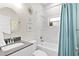 Updated bathroom with a subway-tiled shower and tub combination, plus a stylish vanity at 1013 Lake Elsie Dr, Tavares, FL 32778