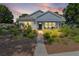 Beautiful home with a covered porch, mature landscaping, and inviting curb appeal at 1013 Lake Elsie Dr, Tavares, FL 32778