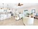Bright and open living area with modern decor, seamlessly connected to the kitchen and dining at 1013 Lake Elsie Dr, Tavares, FL 32778