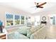 Spacious living room with an open floor plan, seamlessly connected to the kitchen area at 1013 Lake Elsie Dr, Tavares, FL 32778