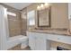 Bathroom features a tiled shower and tub combination with a sleek, granite-topped vanity at 1029 Soledad Way, The Villages, FL 32159