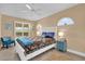 Cozy bedroom features a white bed frame and a ceiling fan at 1029 Soledad Way, The Villages, FL 32159