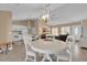 Open-concept dining area connecting to a spacious living room and modern kitchen at 1029 Soledad Way, The Villages, FL 32159