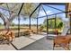 Screened lanai providing an ideal outdoor living space overlooking the green fairways at 1029 Soledad Way, The Villages, FL 32159
