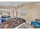 Comfortable main bedroom with a sliding glass closet and ceiling fan at 1029 Soledad Way, The Villages, FL 32159