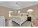 Spacious main bedroom with a ceiling fan and plenty of sunlight at 1029 Soledad Way, The Villages, FL 32159