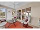 Relaxing sunroom filled with natural light, comfortable seating, and access to the outdoors at 1029 Soledad Way, The Villages, FL 32159