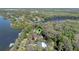 Overhead real estate shot of lakefront house with a green pin to mark the location at 11215 Dead River Rd, Tavares, FL 32778