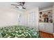 This bedroom features hardwood floors, a closet, and built in shelves at 11215 Dead River Rd, Tavares, FL 32778