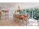 Bright dining room with large windows and stylish chandelier at 11215 Dead River Rd, Tavares, FL 32778