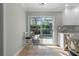 Bright kitchen nook area with sliding glass doors leading to the outdoor pool area at 11215 Dead River Rd, Tavares, FL 32778