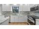 Bright kitchen featuring marble countertops, stainless steel appliances and ample cabinet space at 11215 Dead River Rd, Tavares, FL 32778