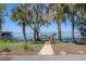 Scenic lake view with a private dock, perfect for relaxing and enjoying waterfront living at 11215 Dead River Rd, Tavares, FL 32778