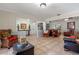 Open concept living room with comfortable seating and access to multiple rooms at 11215 Dead River Rd, Tavares, FL 32778