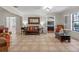 Inviting living room with stylish furnishings, neutral walls, and access to additional rooms at 11215 Dead River Rd, Tavares, FL 32778