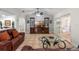 Inviting living room with comfortable seating, ceiling fan, and sliding door entry at 11215 Dead River Rd, Tavares, FL 32778