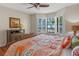 This bedroom features a view to the water, hardwood floors, and a bed at 11215 Dead River Rd, Tavares, FL 32778