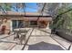 This is a brick outdoor kitchen area with a grill and bar in the screened-in lanai at 11215 Dead River Rd, Tavares, FL 32778