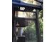 Outdoor shower with rainfall head, situated amongst lush greenery and tropical plants at 11215 Dead River Rd, Tavares, FL 32778