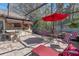 Covered patio with an outdoor bar, grill, and seating area under a screened enclosure at 11215 Dead River Rd, Tavares, FL 32778