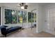 This sunroom features lots of windows, tile flooring, and a chaise lounge at 11215 Dead River Rd, Tavares, FL 32778