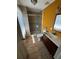 A full bathroom with a walk-in shower is complete with updated vanity and color-coordinated walls at 11701 Layton St, Leesburg, FL 34788