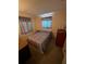 Comfortable bedroom with a cozy bed and striped curtains at 11701 Layton St, Leesburg, FL 34788