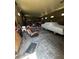 Spacious garage interior with vehicles and storage. Ideal for car enthusiasts or hobbyists at 11701 Layton St, Leesburg, FL 34788