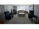 Inviting living room with plush seating, a coffee table, and natural light at 11701 Layton St, Leesburg, FL 34788