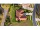 Aerial view of the home showcasing the roof and surrounding greenery at 12127 Cypress Landing Ave, Clermont, FL 34711