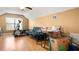 Bonus room features a laminate floor, window, and home gym equipment, offering flexible space at 12127 Cypress Landing Ave, Clermont, FL 34711