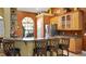 Kitchen with stainless steel appliances, granite countertops, breakfast bar, and lots of natural light at 12127 Cypress Landing Ave, Clermont, FL 34711