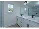Modern bathroom featuring dual vanity, sleek black fixtures, and a luxurious shower, creating a spa-like space at 1307 E Harding St, Orlando, FL 32806