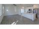 Spacious living room featuring an open kitchen with modern appliances and abundant natural light at 1307 E Harding St, Orlando, FL 32806