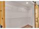 Open closet with white wire shelving and a natural wood sliding barn door at 13334 Sw 107 St, Dunnellon, FL 34432