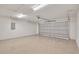 Spacious two car garage featuring epoxy floor, bright lighting, and an automatic door at 13334 Sw 107 St, Dunnellon, FL 34432