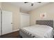 Well-lit bedroom showcases a closet, plush headboard, and neutral paint at 13753 Via Roma Cir, Clermont, FL 34711