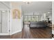Inviting living area featuring dark hardwood floors and abundant natural light at 13753 Via Roma Cir, Clermont, FL 34711