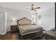 Comfortable main bedroom featuring wood floors, and neutral colors offering a peaceful retreat at 13753 Via Roma Cir, Clermont, FL 34711