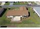 Aerial view of the home featuring a fenced-in backyard with patio at 13828 Se 85Th Cir, Summerfield, FL 34491