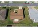 Aerial perspective highlighting the roof and back yard of this single Gathering home at 13828 Se 85Th Cir, Summerfield, FL 34491