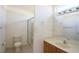 Bathroom features a glass-enclosed shower and vanity at 13828 Se 85Th Cir, Summerfield, FL 34491