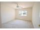 Neutral bedroom featuring carpet, a ceiling fan, and a window for natural light at 13828 Se 85Th Cir, Summerfield, FL 34491