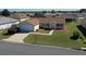 Charming single-story home with well-maintained lawn and a driveway at 13828 Se 85Th Cir, Summerfield, FL 34491