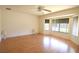Bright and airy living room with wood-look floors and a large bay window at 13828 Se 85Th Cir, Summerfield, FL 34491