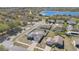 Aerial view of a home in a neighborhood near a lake at 1391 Willow Crest Dr, Clermont, FL 34711