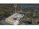 Aerial view of home with fenced backyard and sidewalk access on corner lot near lake at 1391 Willow Crest Dr, Clermont, FL 34711