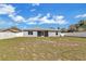 Spacious backyard featuring a lawn and a privacy fence at 1391 Willow Crest Dr, Clermont, FL 34711