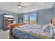 Spacious bedroom featuring a sloped ceiling, carpet, and plenty of natural light from the window at 1391 Willow Crest Dr, Clermont, FL 34711