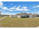 Home exterior with a manicured lawn and water view at 1391 Willow Crest Dr, Clermont, FL 34711